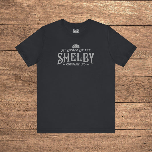 Black Bella+Canvas 3001 t-shirt featuring a Shelby Company Limited logo graphic from Peaky Blinders.