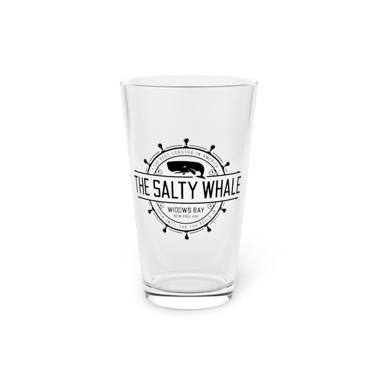 Clear 16 oz pint glass with the vintage black Salty Whale maritime crest logo from Widow's Bay, with white background
