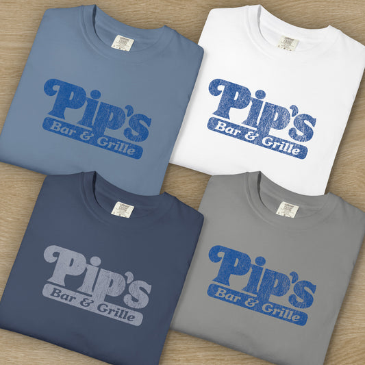 4 folded Vintage-style Pip’s Bar & Grill t-shirts from Severance on Comfort Colors 1717 with distressed logo.