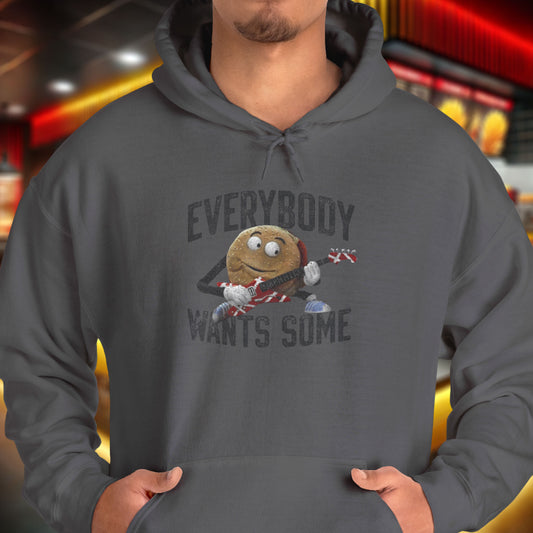 Male model wearing a charcoal grey colored soft Unisex Hoodie Heavy Blend Hooded Sweatshirt featuring the phrase EVERYBODY WANTS SOME with a graphic of the Van Halen singing hamburger playing guitar from the movie Better Off Dead, designed by ScriptedBrand in a vintage distressed style.