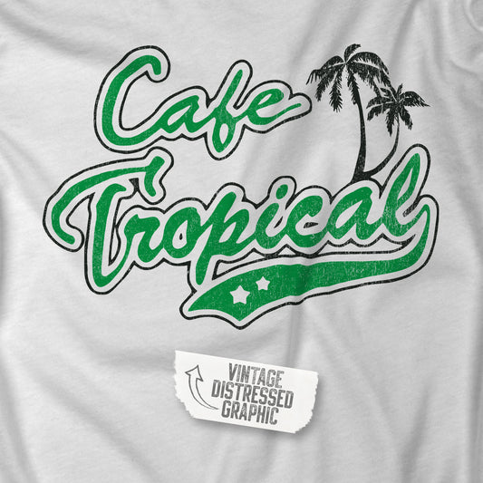 Closeup view of a white and Green colored soft raglan 3/4 sleeve Tultex 245 baseball shirt featuring the fictional Cafe Tropical logo that David wore in the TV Show Schitts Creek in a vintage distressed style, sold by ScriptedBrand.