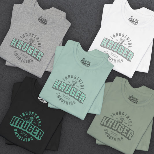 Group of 5 folded Soft unisex Bella+Canvas 3001 short-sleeve t-shirts featuring a Kruger Industrial Smoothing logo graphic in a vintage distressed style, designed by ScriptedBrand, and inspired by the TV show Seinfeld.