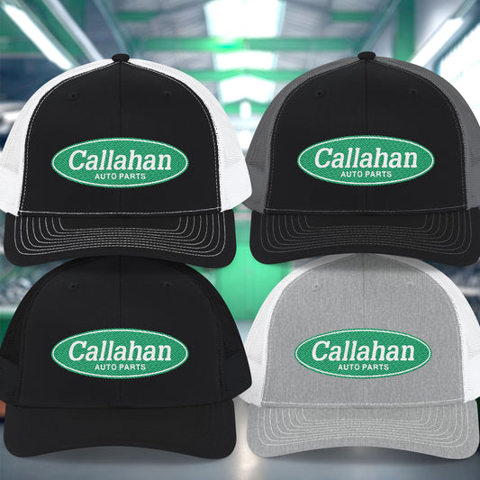 Four Callahan Auto Parts hats in different color combinations on a blurred background.