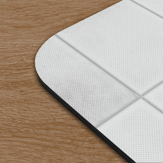 Closeup corner view of a Mouse pad featuring Aperture Laboratories logo with a panel wall texture design on a desk.