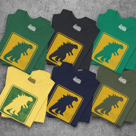 Six folded Godzilla Evacuation Route distressed graphic t-shirts inspired by Monarch Legacy of Monsters, soft Bella+Canvas tee