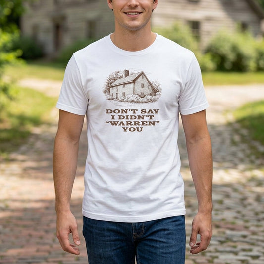 Person wearing White Bella+Canvas tee with vintage Warren house illustration and the pun "Don't Say I Didn't Warren You" from Widow's Bay show
