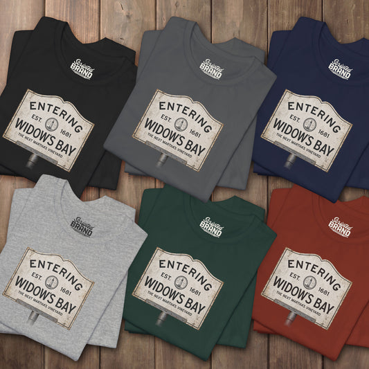 Six folded 'Entering Widow's Bay' vintage town sign t-shirts inspired by Apple TV series, soft Bella+Canvas cotton New England tee