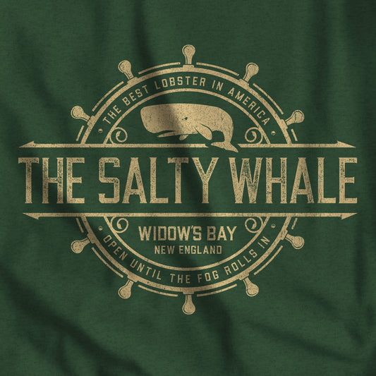 Closeup of Heather green long-sleeve tee with the gold distressed Salty Whale maritime crest logo from Widow's Bay, New England