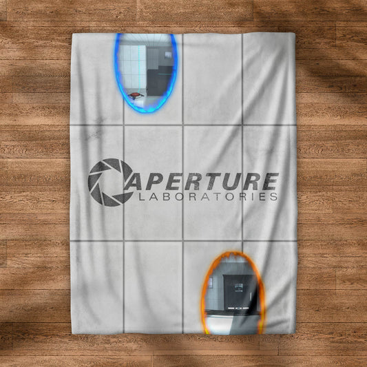 Flat view of Velveteen plush blanket with Portal 2 panel wall, Aperture Laboratories logo, and blue and orange portals.