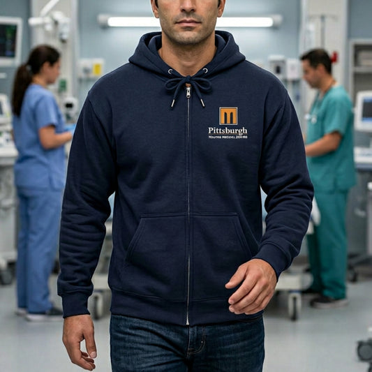 Man wearing Navy full-zip hoodie with the Pittsburgh Trauma Medical Center (PTMC) logo from The Pitt, printed on the left chest