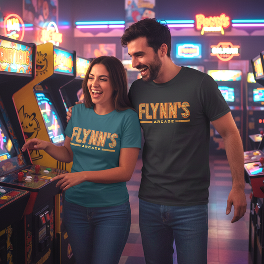 2 people at an arcade wearing t-shirts with vintage distressed 'Flynn’s Arcade' neon sign logo inspired by TRON