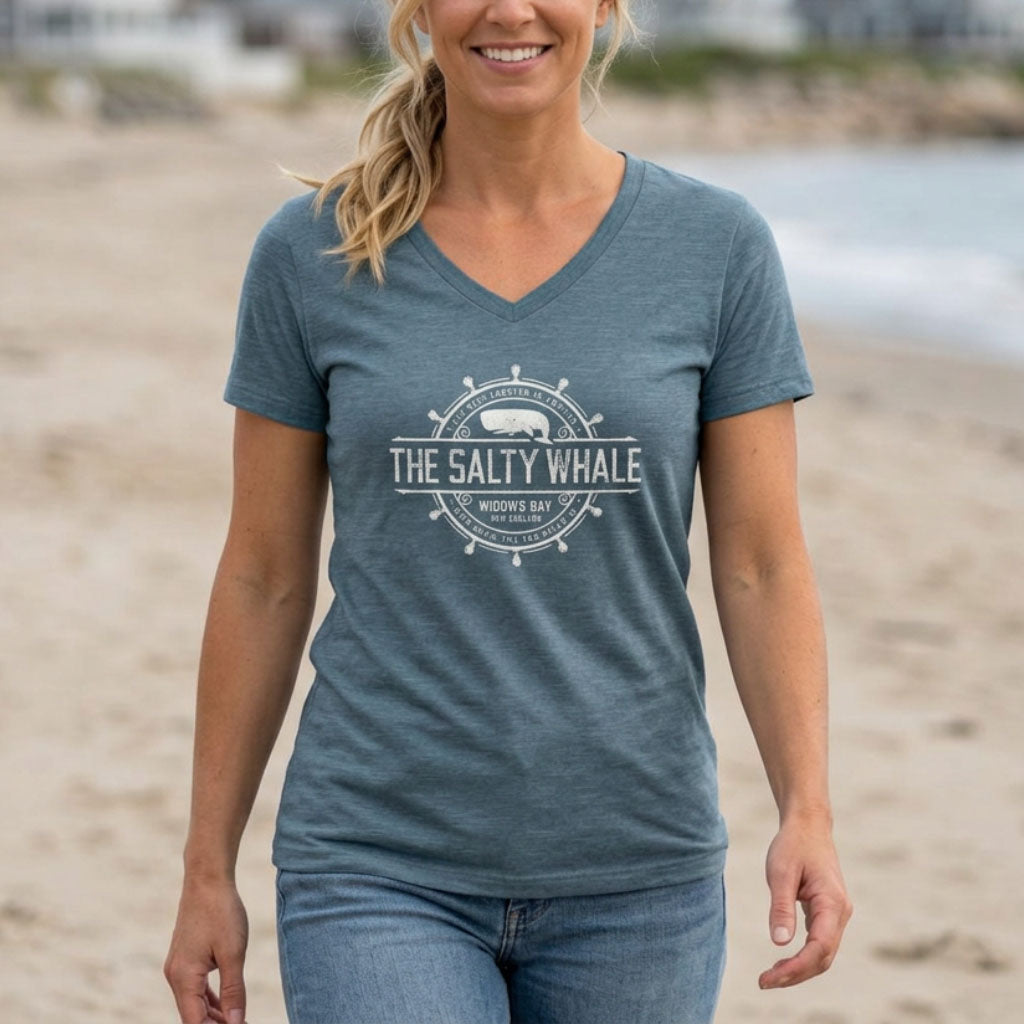 Woman wearing Heather slate blue womens v-neck tee with vintage The Salty Whale nautical crest inspired by Widow's Bay show