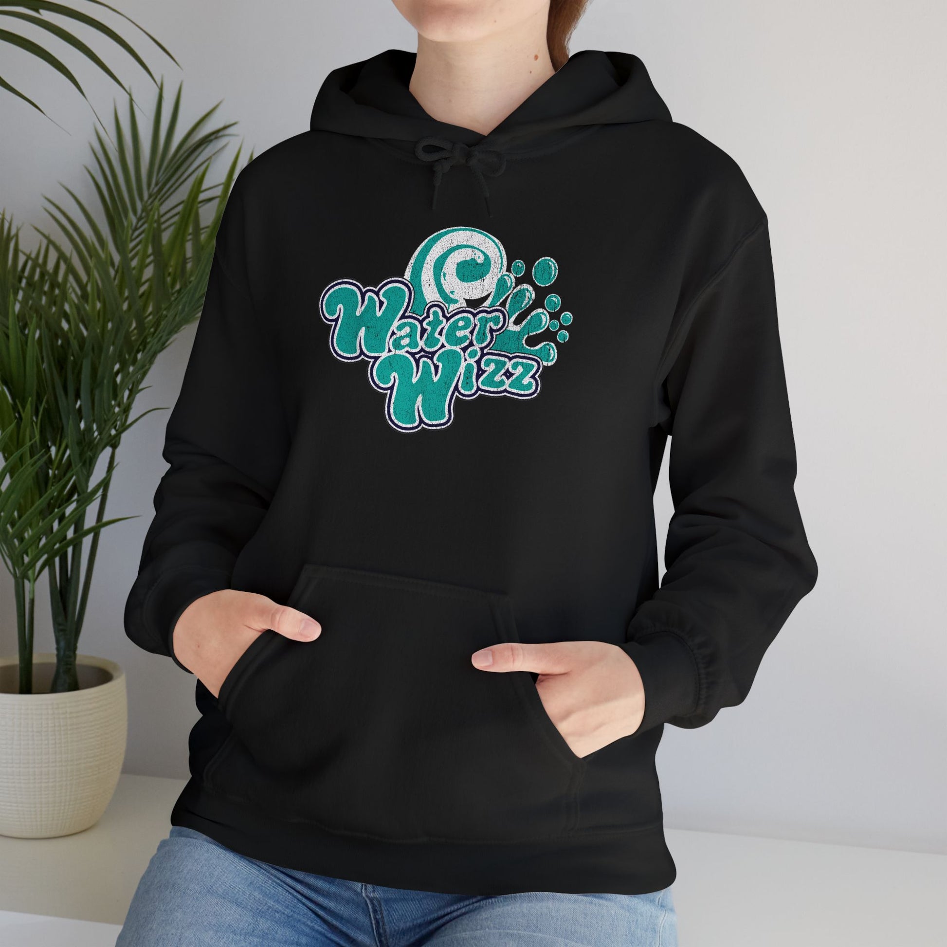 Woman wearing black Gildan 18500 pullover hoodie with vintage distressed Water Wizz logo from Grown Ups on the chest.