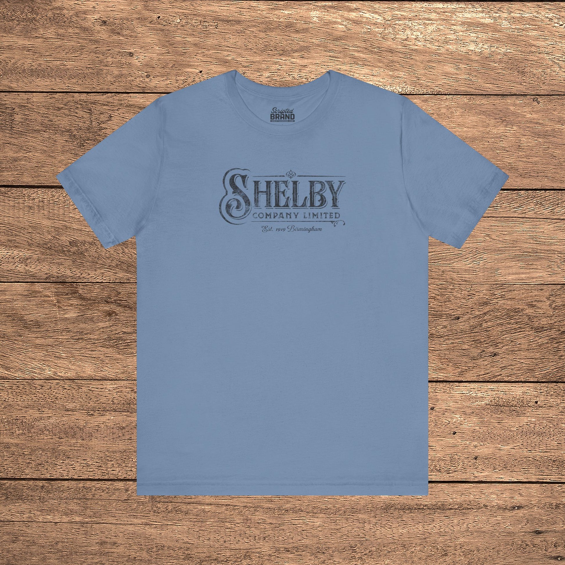 Steel blue Bella+Canvas 3001 t-shirt featuring a vintage Shelby Company Limited logo from Peaky Blinders.
