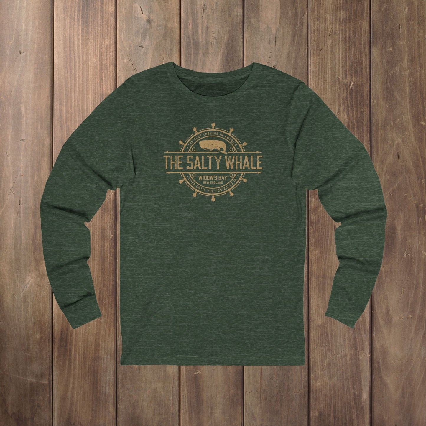 Heather forest green long-sleeve tee with the gold distressed Salty Whale maritime crest logo from Widow's Bay, New England