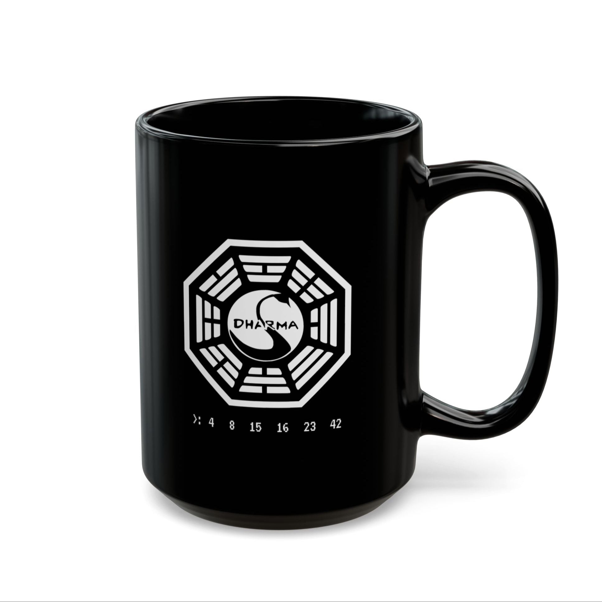 Mockup view of 15 oz Black Ceramic Mug on a desk featuring the Dharma Initiative swan station logo from the TV show LOST, including the Hatch numbers 4 8 15 16 23 42. Graphic is printed white on both sides.