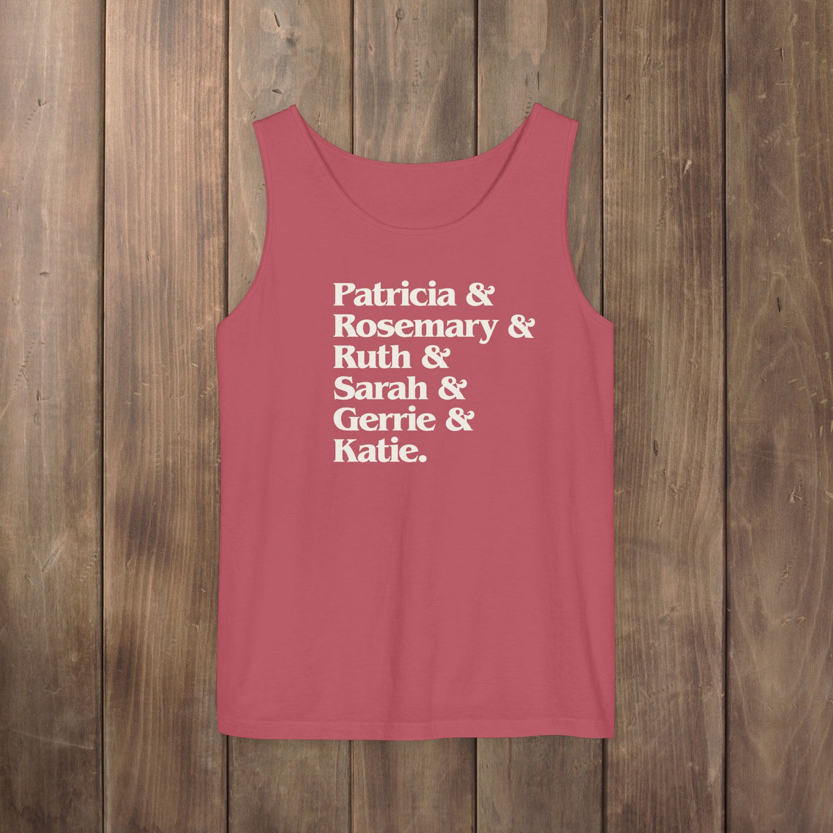 Crimson red garment-dyed Comfort Colors tank top with stacked Women of Widow's Bay show names in ampersand list including Patricia, Ruth, Rosemary