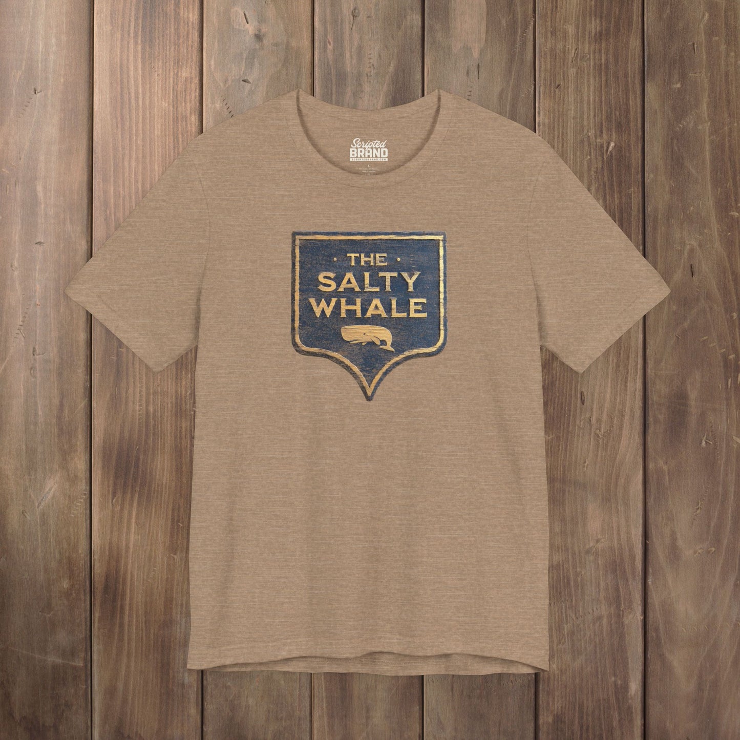 Heather Tan colored 'The Salty Whale' weathered carved-wood pub sign t-shirt inspired by Widow's Bay Apple TV series, heather Bella+Canvas tee
