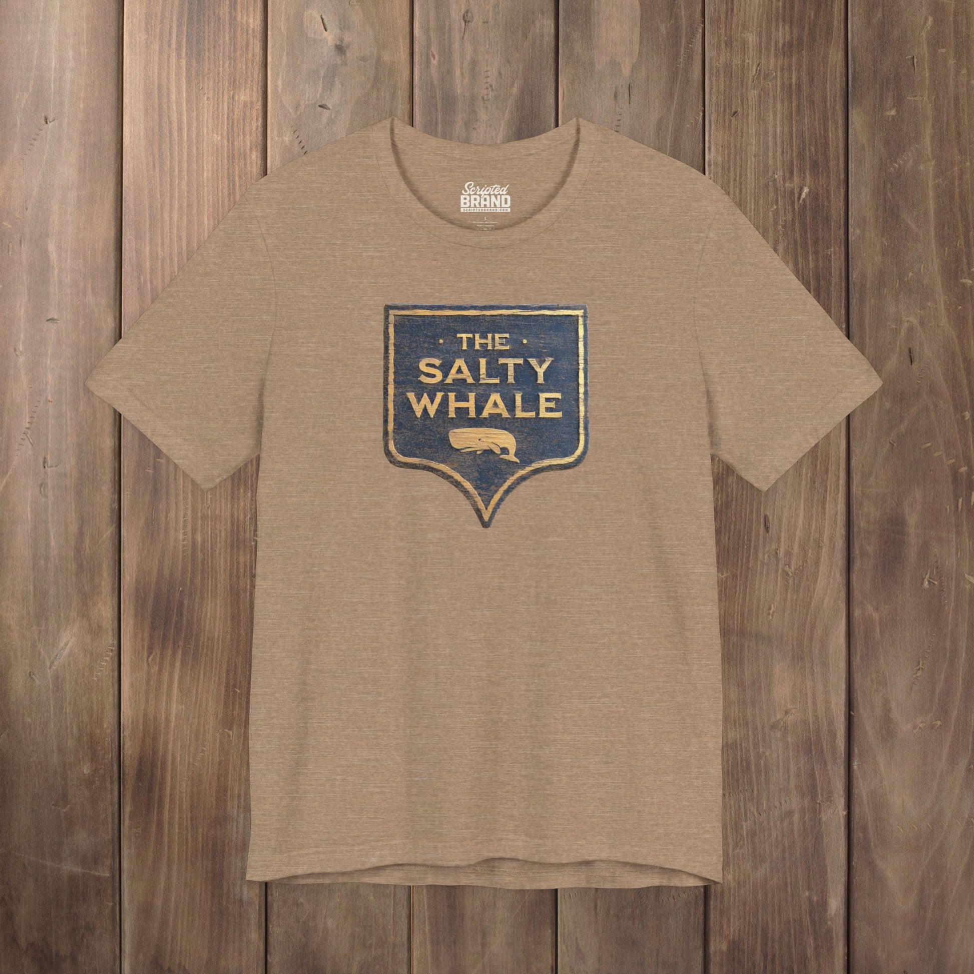 Heather Tan colored 'The Salty Whale' weathered carved-wood pub sign t-shirt inspired by Widow's Bay Apple TV series, heather Bella+Canvas tee