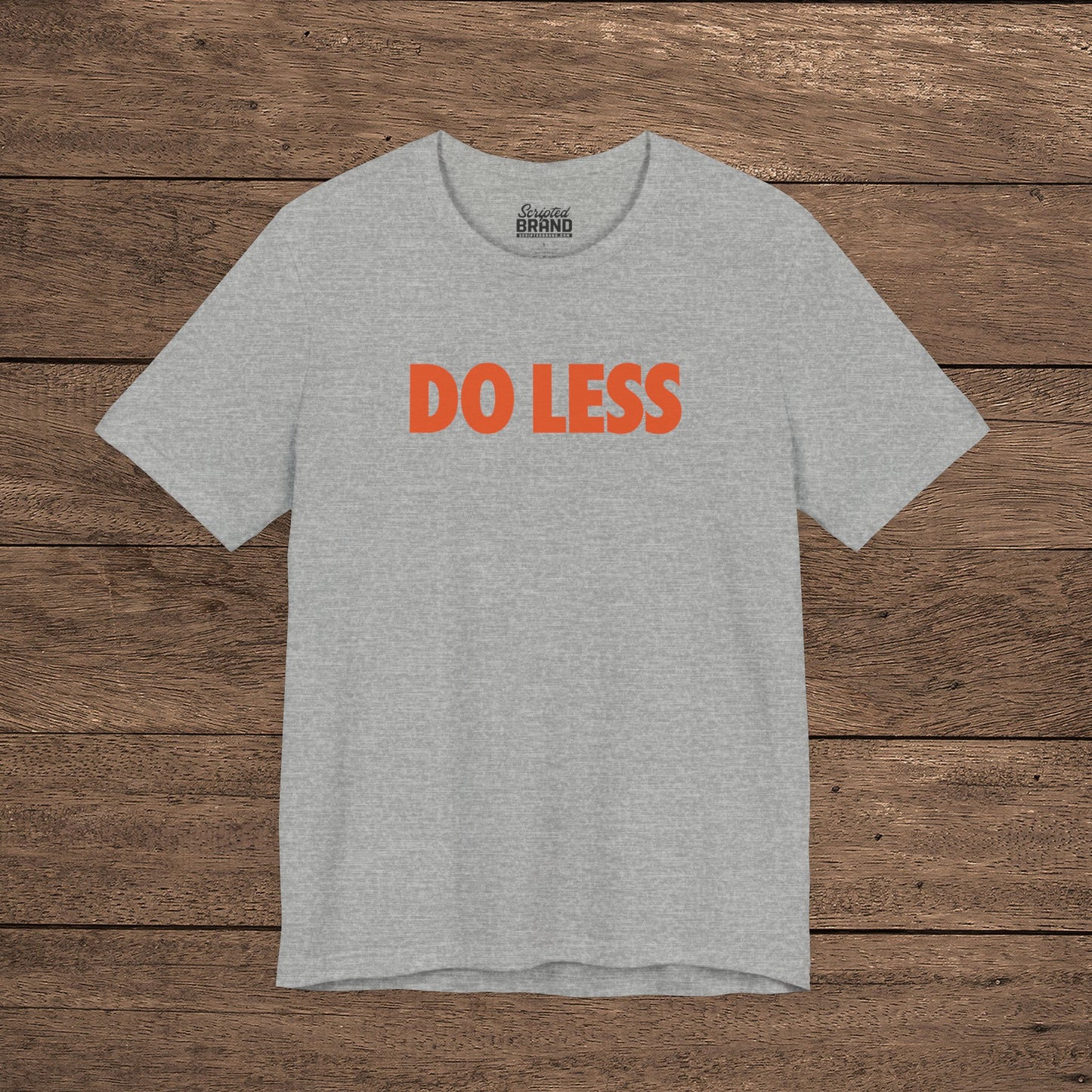 Heather gray colored 'Do Less' graphic t-shirt inspired by Shrinking TV show, Bella+Canvas cotton tee with orange type
