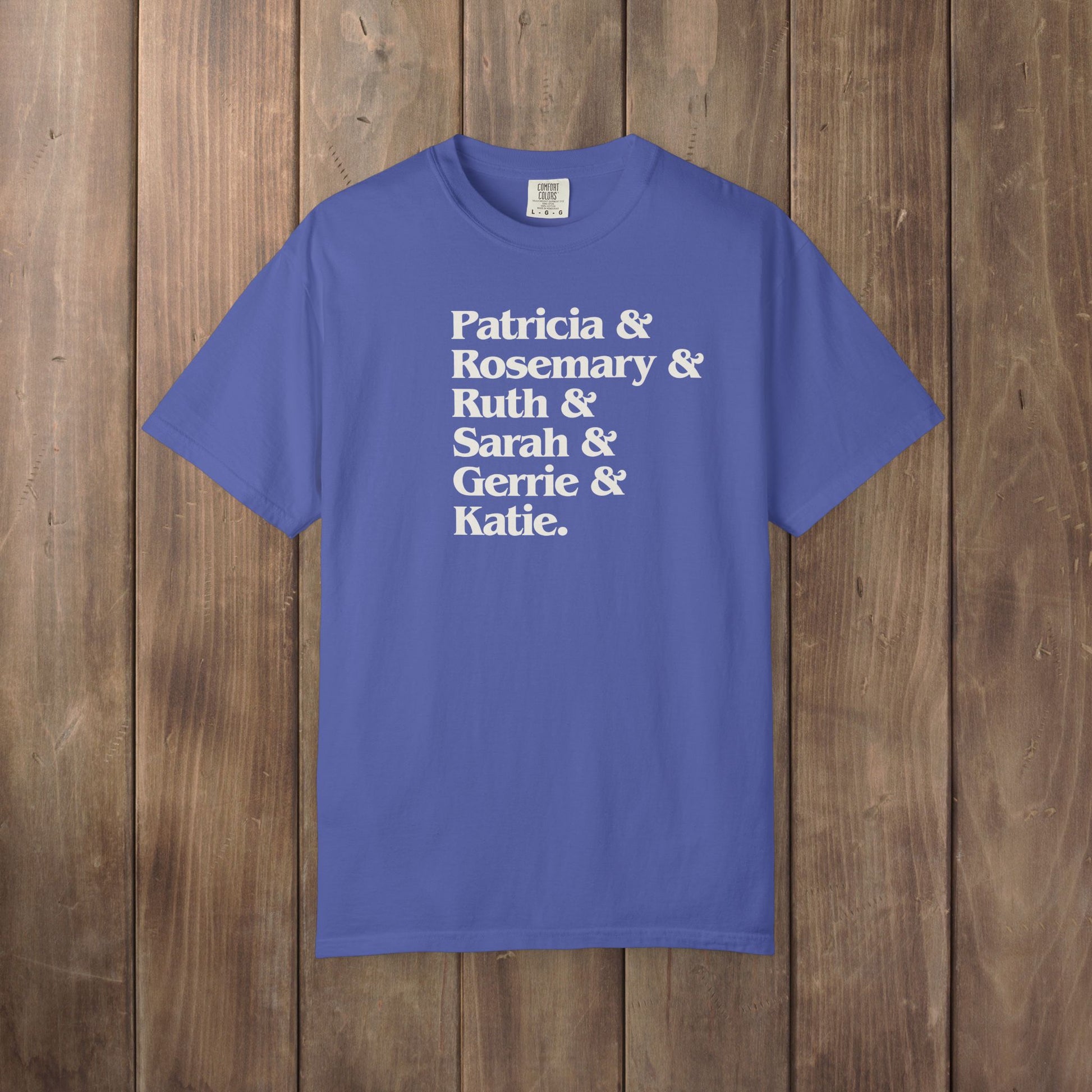 Periwinkle blue Comfort Colors tee listing the women of Widow's Bay: Patricia, Rosemary, Ruth, Sarah, Gerrie, and Katie