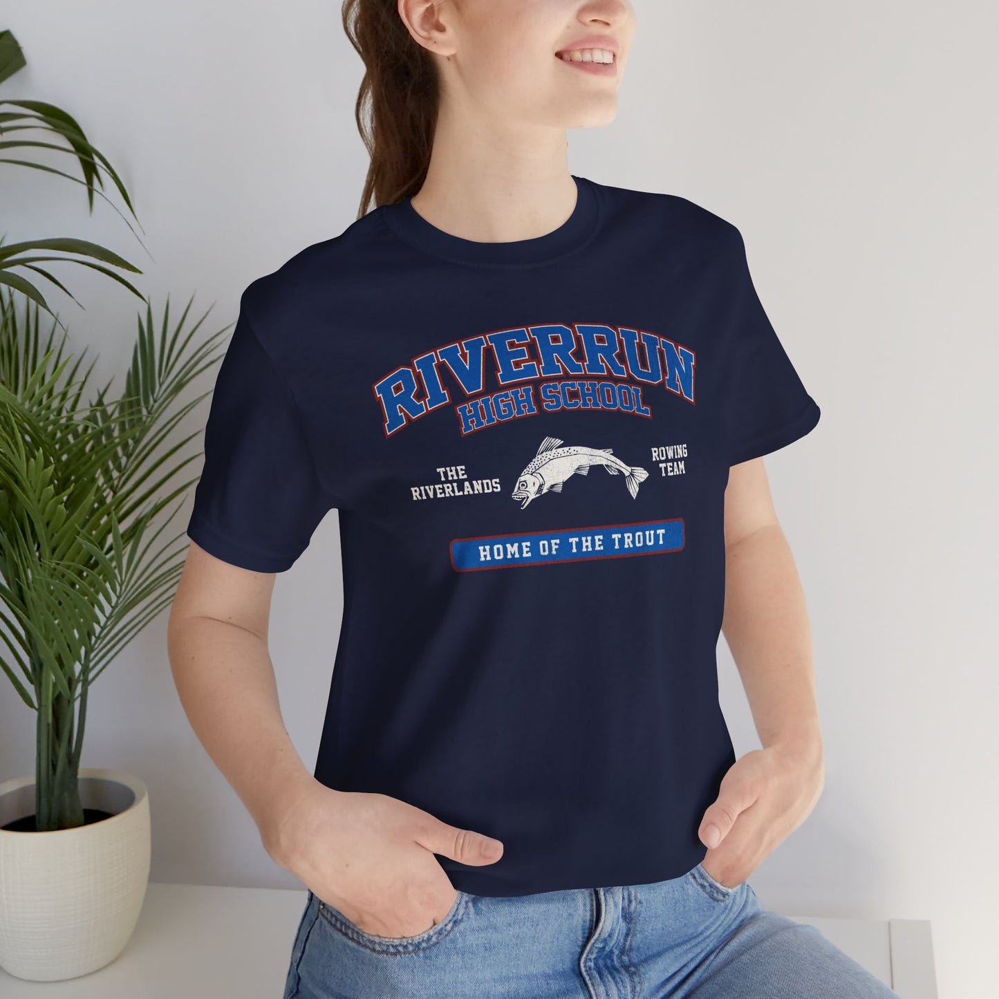 Woman wearing Navy blue Riverrun High School t-shirt with vintage fish graphic inspired by Game of Thrones and House Tully.