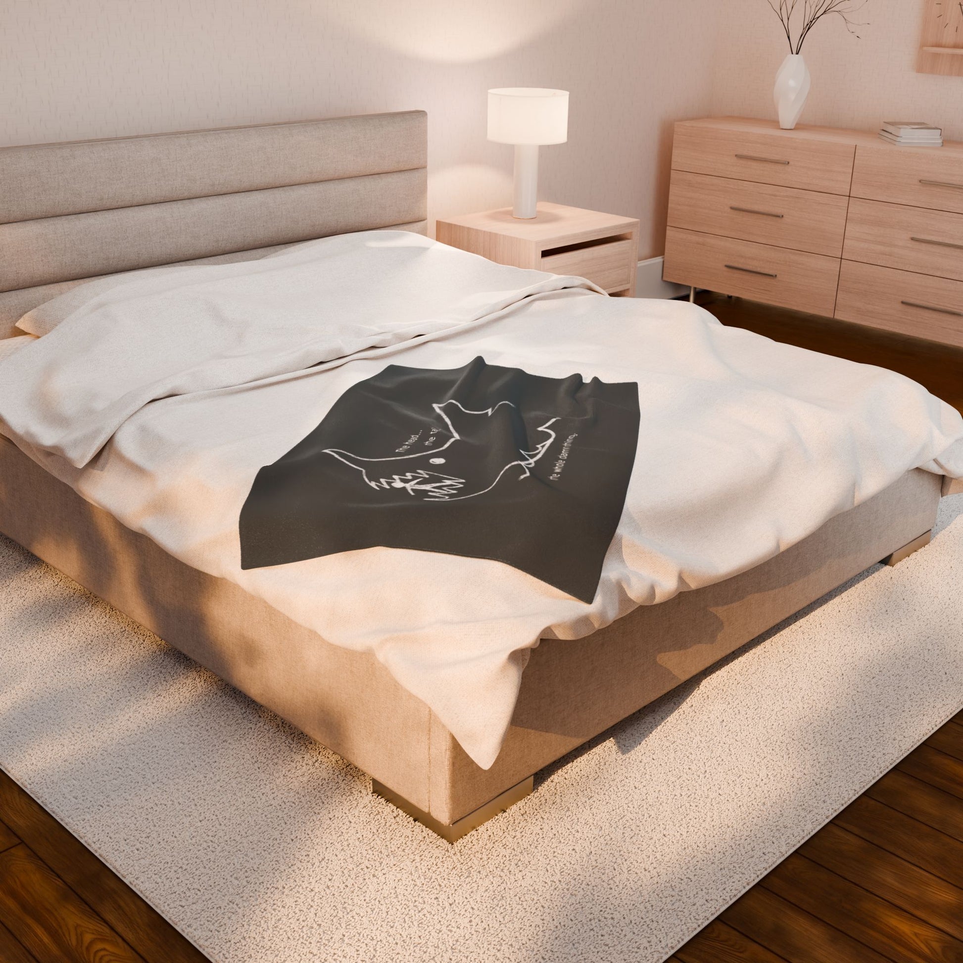 Angled view of 30x40 Velveteen plush blanket with Quint’s chalkboard shark drawing from Jaws, shown draped on a bed.