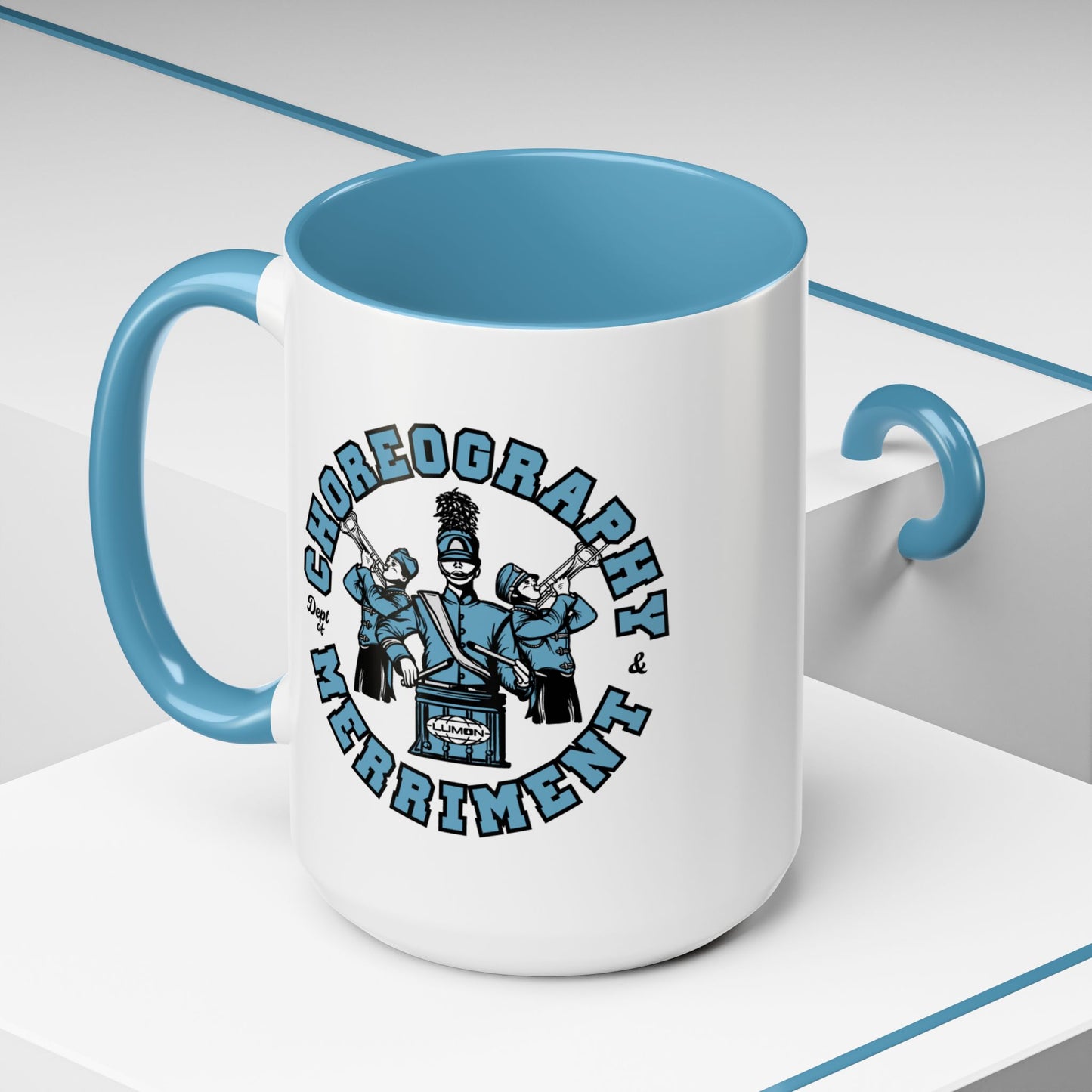 Angled view of 15 oz White ceramic accent mug with blue handle featuring Severance Dept. of Choreography & Merriment graphic.
