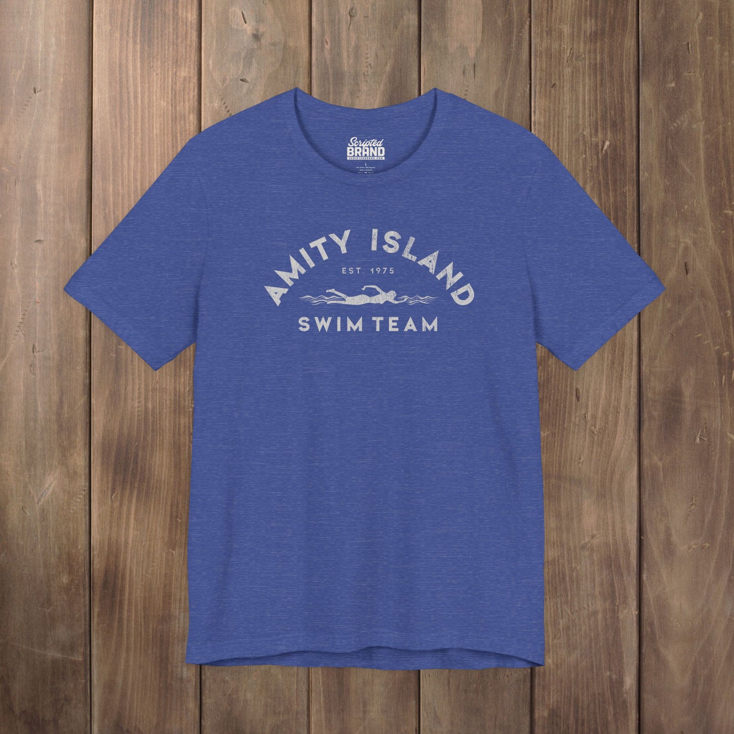 Heather Royal Blue tee with vintage distressed Amity Island Swim Team Jaws-inspired swimmer logo