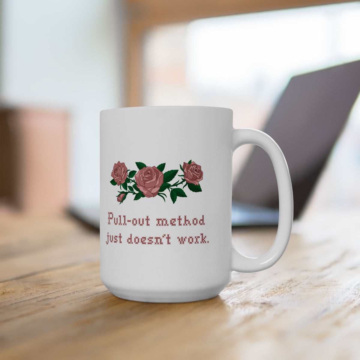 15oz White mug on a desk with pink roses and Pull-out method just doesn't work in cross stitch, inspired by Ruth in Widow's Bay