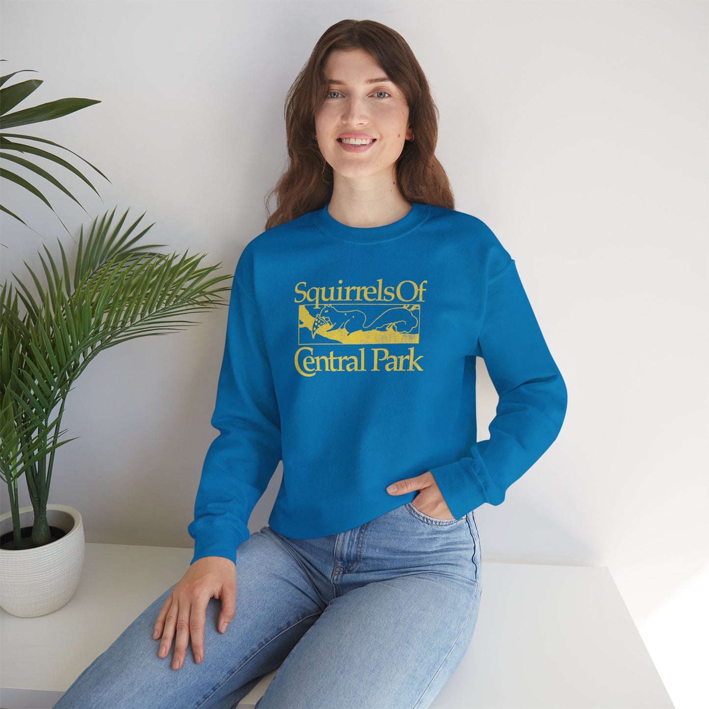 Woman wearing Sapphire blue Squirrels Of Central Park vintage distressed crewneck sweatshirt inspired by Bad Sisters.