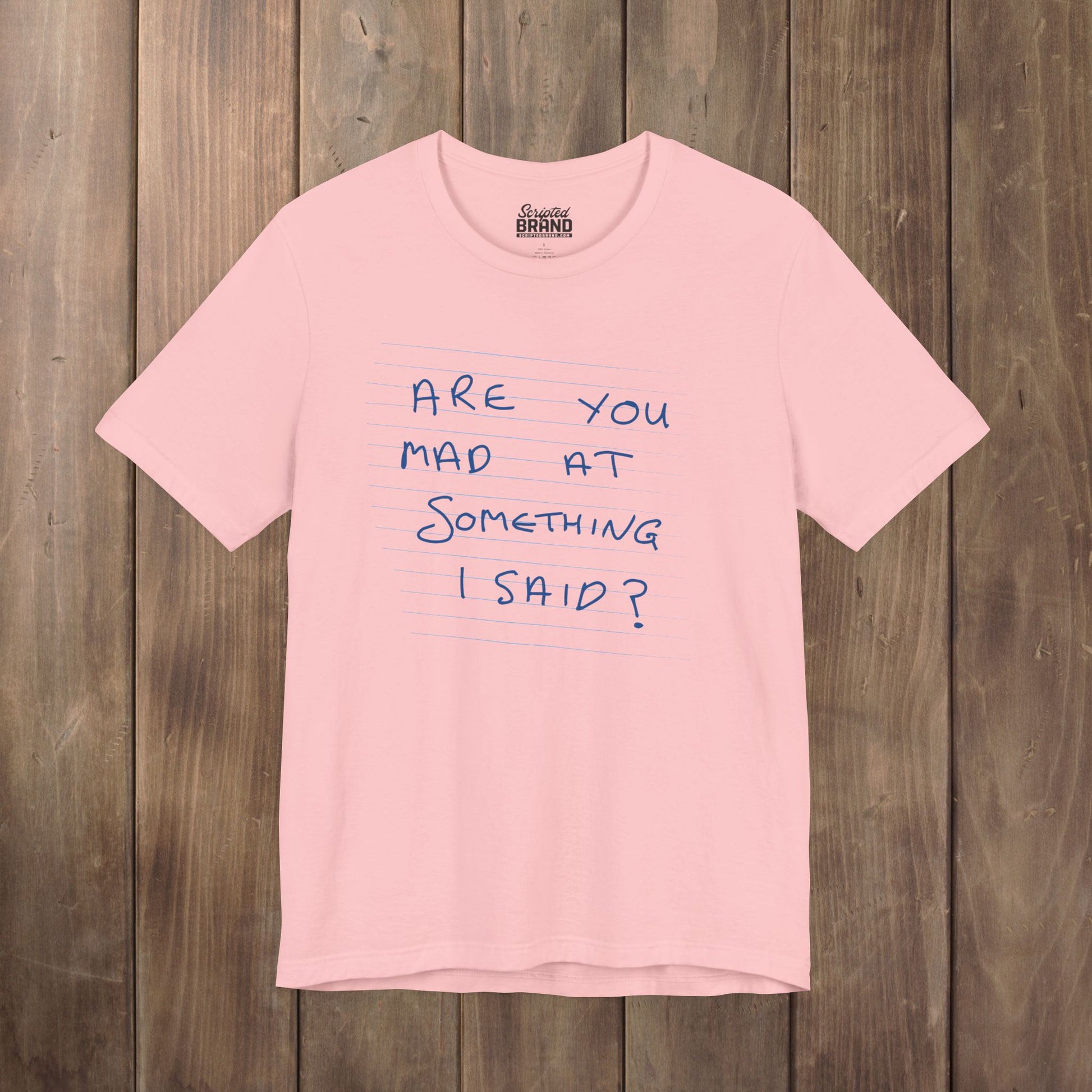 Pink t-shirt with handwritten Patricia note from Widow's Bay reading "Are You Mad At Something I Said?"