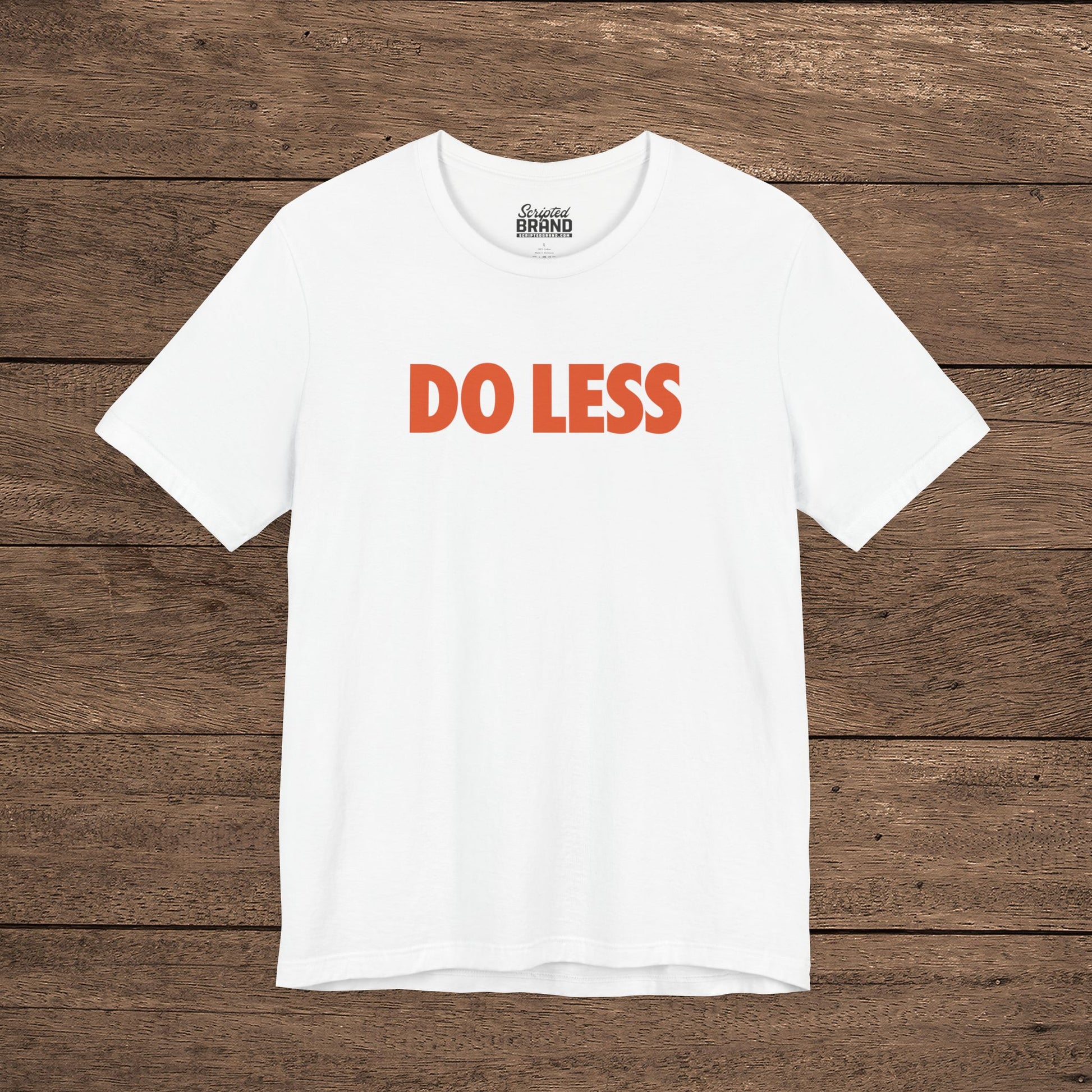 white colored 'Do Less' graphic t-shirt inspired by Shrinking TV show, Bella+Canvas cotton tee with orange type
