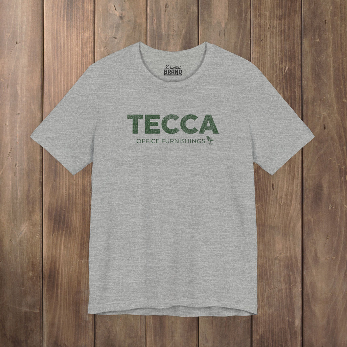 Heather gray TECCA Office Furnishings tee inspired by The Chair Company. Bella+Canvas tim robinson shirt comedy.