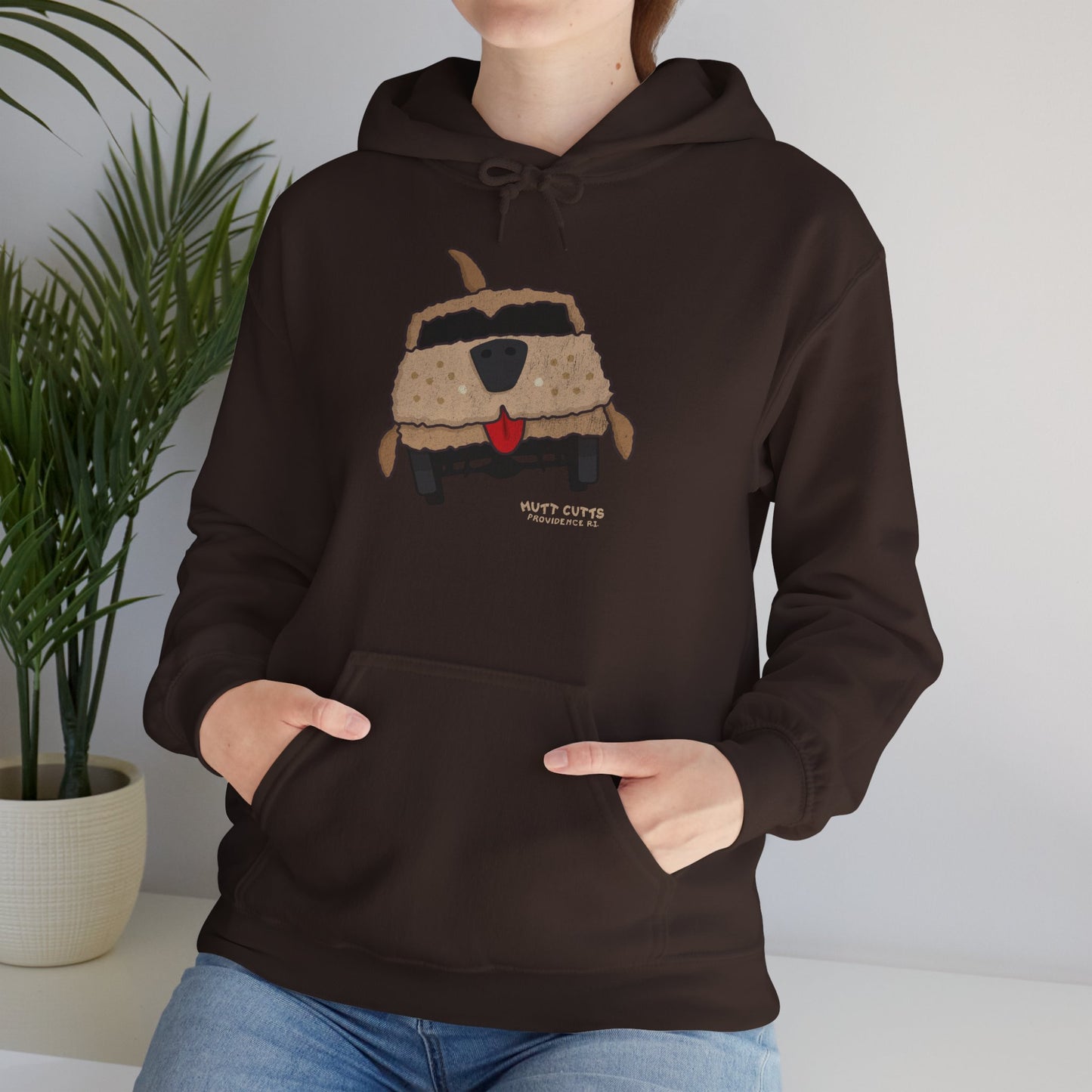 Woman wearing Chocolate brown colored Gildan 18500 hoodie with vintage distressed Mutt Cutts dog van graphic inspired by Dumb and Dumber movie.