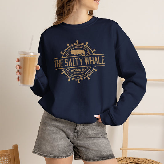 Woman wearing Navy blue Gildan crewneck sweatshirt with the distressed Salty Whale maritime crest logo from TV show Widow's Bay