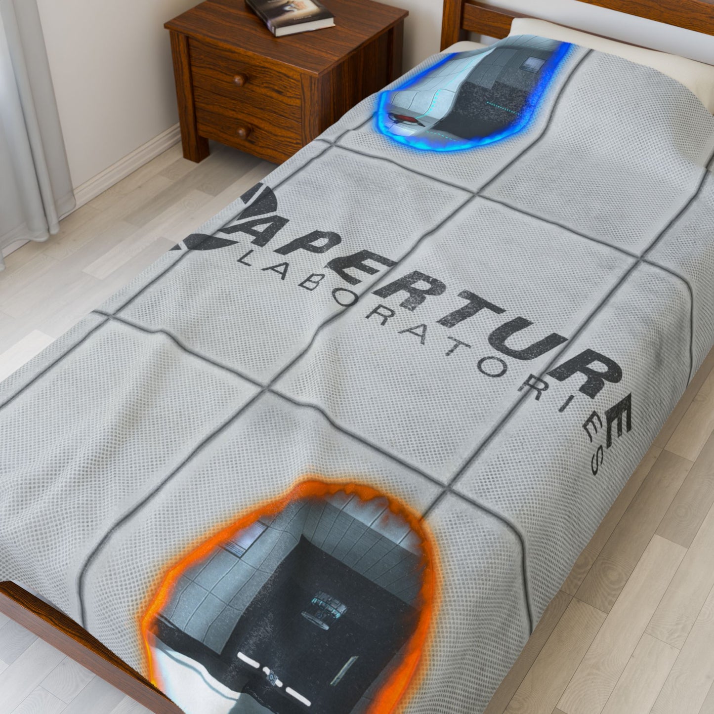 Angled view of 60x80 Velveteen plush blanket with Portal 2 panel wall, Aperture Laboratories logo, and blue and orange portals, shown on a bed.