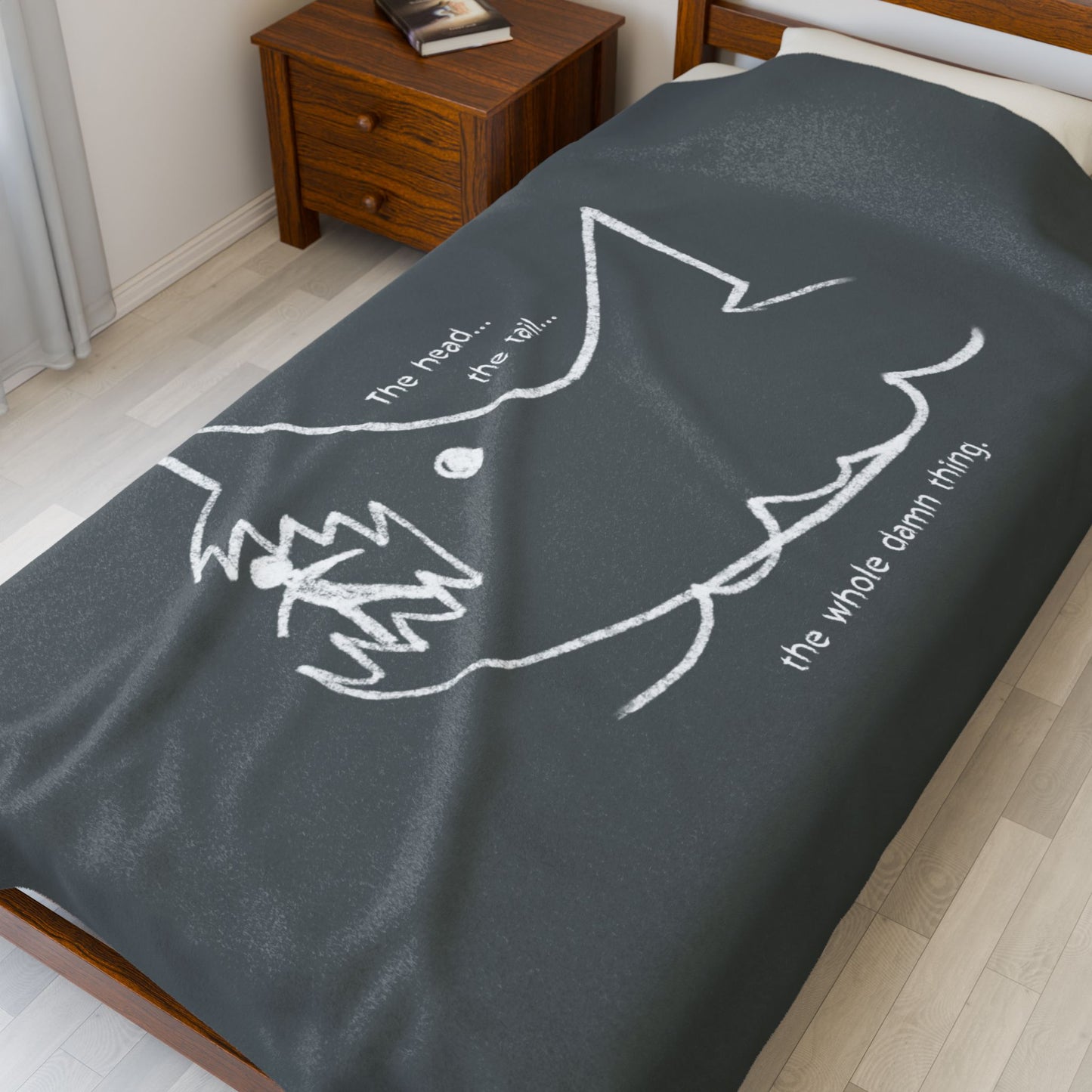 60x80 Velveteen plush blanket with Quint’s chalkboard shark drawing from Jaws, shown draped on a bed.