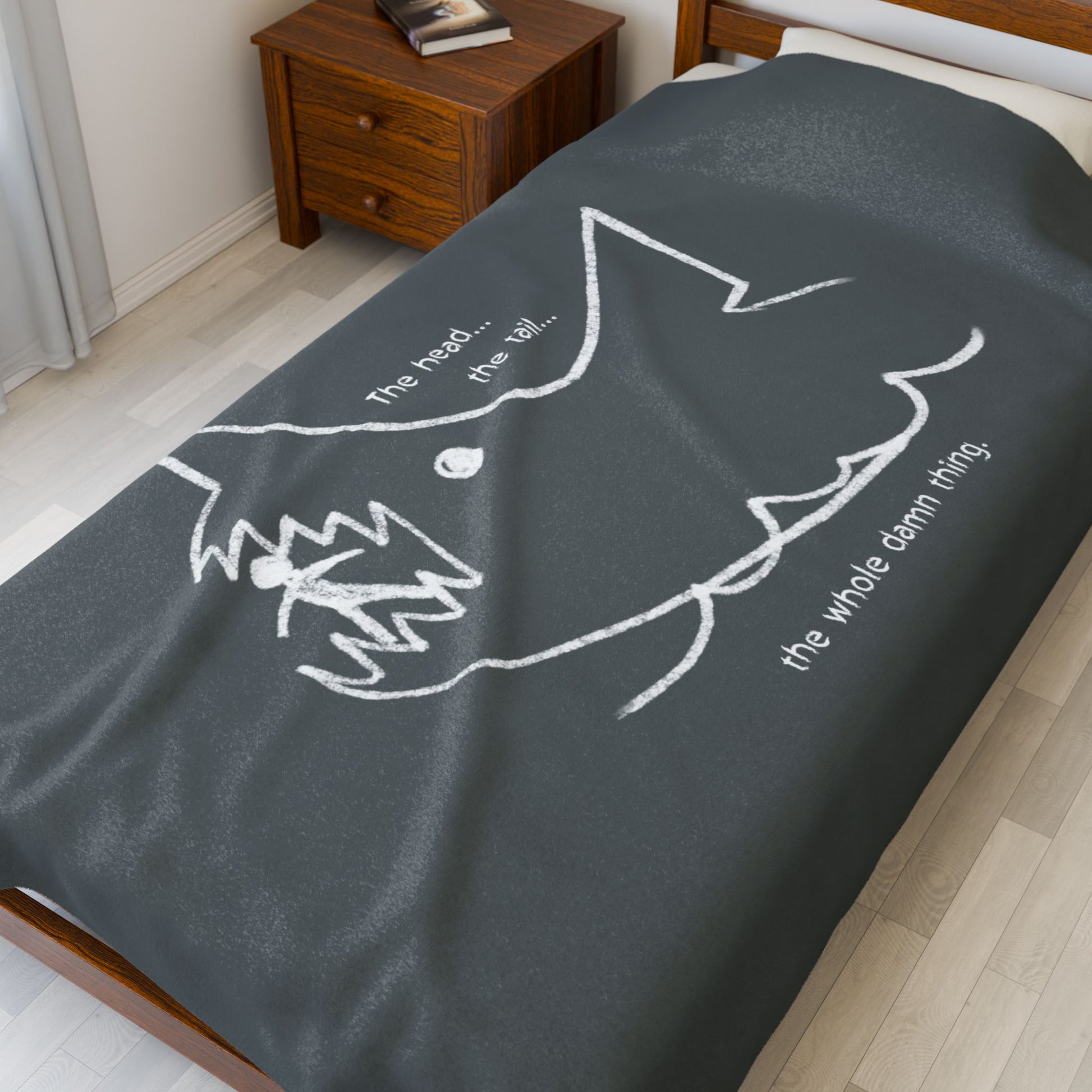 60x80 Velveteen plush blanket with Quint’s chalkboard shark drawing from Jaws, shown draped on a bed.