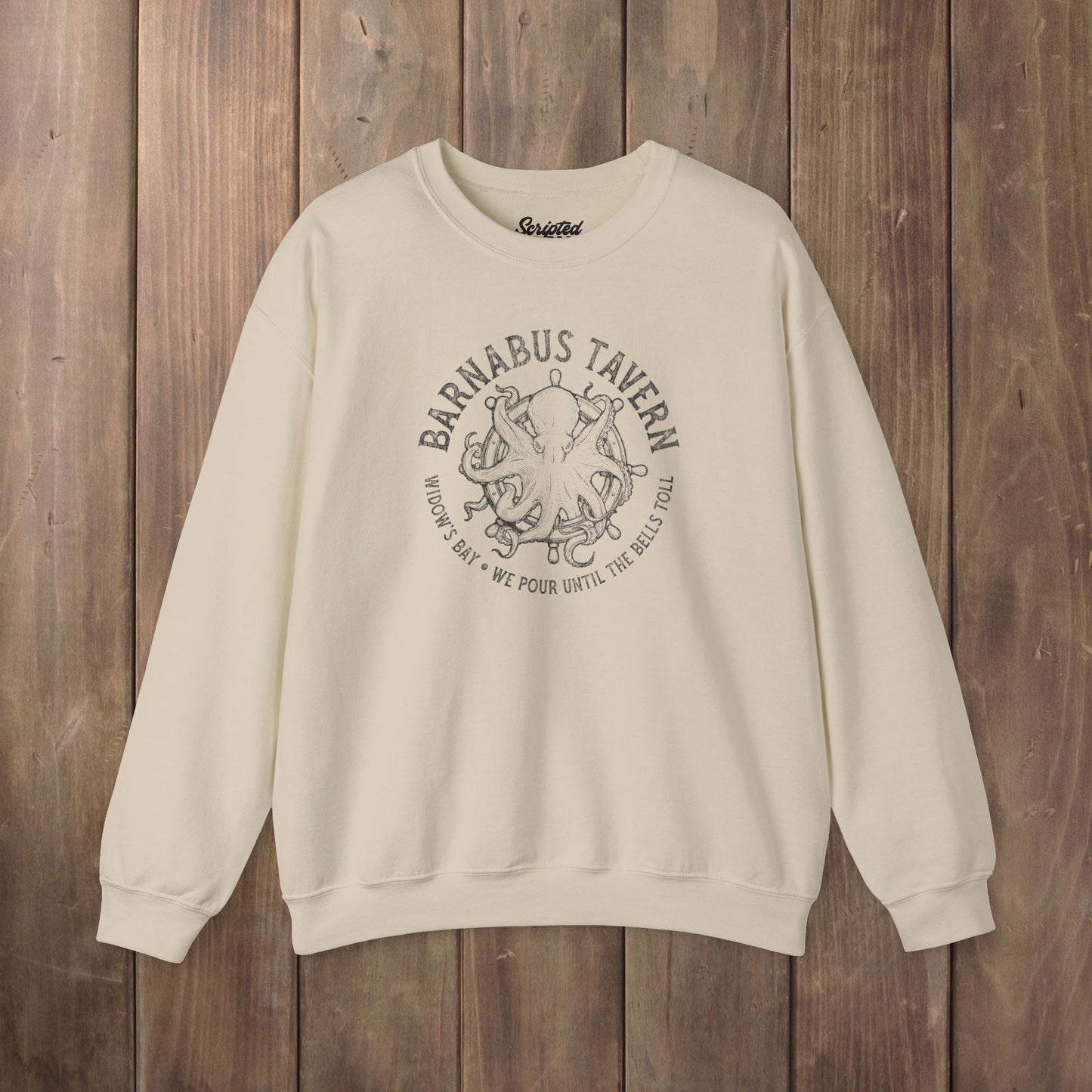 Tan crewneck sweatshirt with vintage Barnabus Tavern graphic from Widow's Bay TV show octopus design