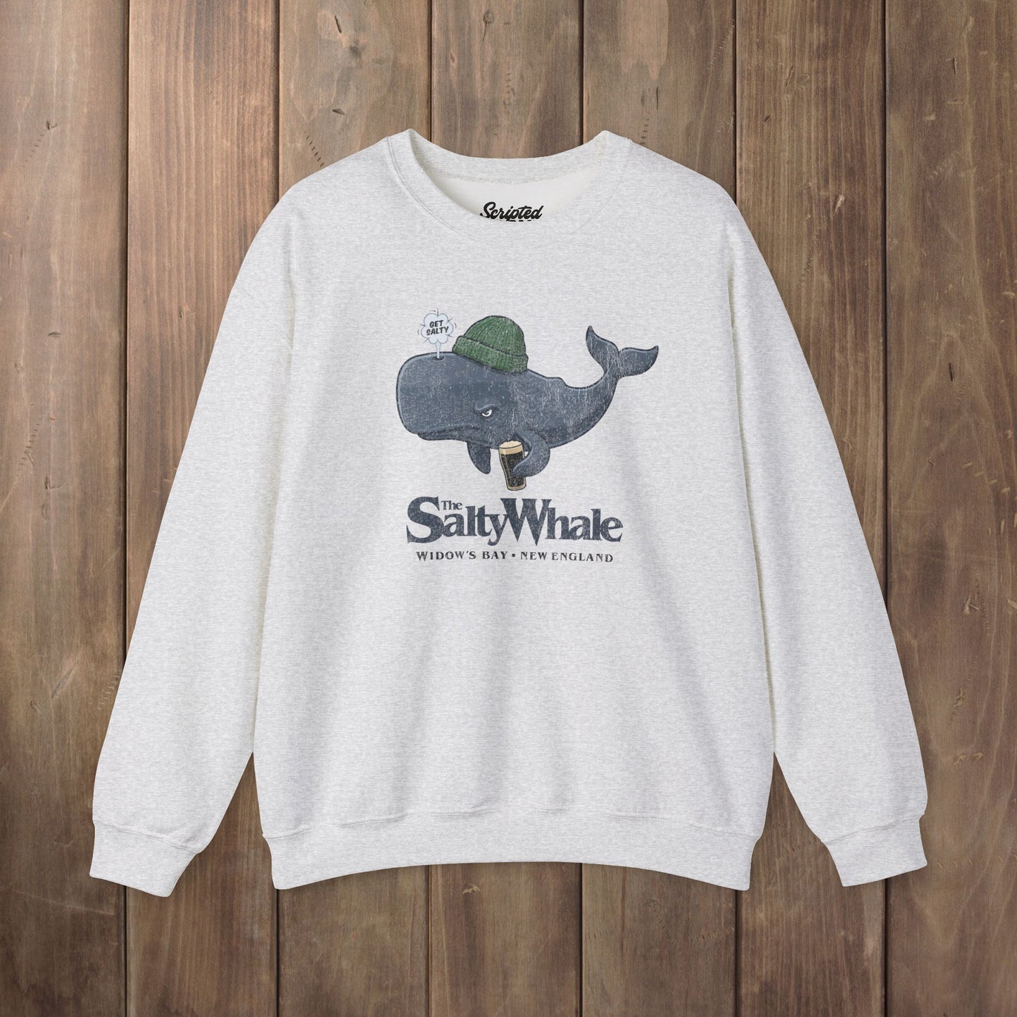 Ash colored The Salty Whale cartoon mascot crewneck sweatshirt inspired by Widow's Bay Apple TV series, vintage pub fan pullover