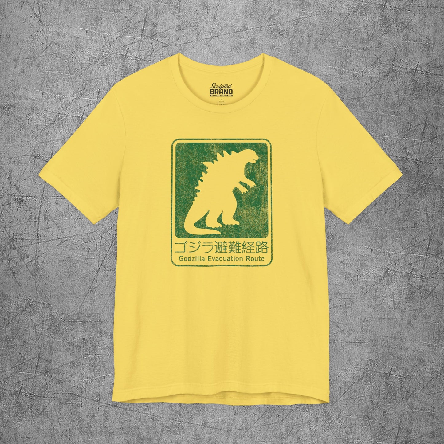 Yellow Godzilla Evacuation Route distressed graphic t-shirt inspired by Monarch Legacy of Monsters, soft Bella+Canvas tee