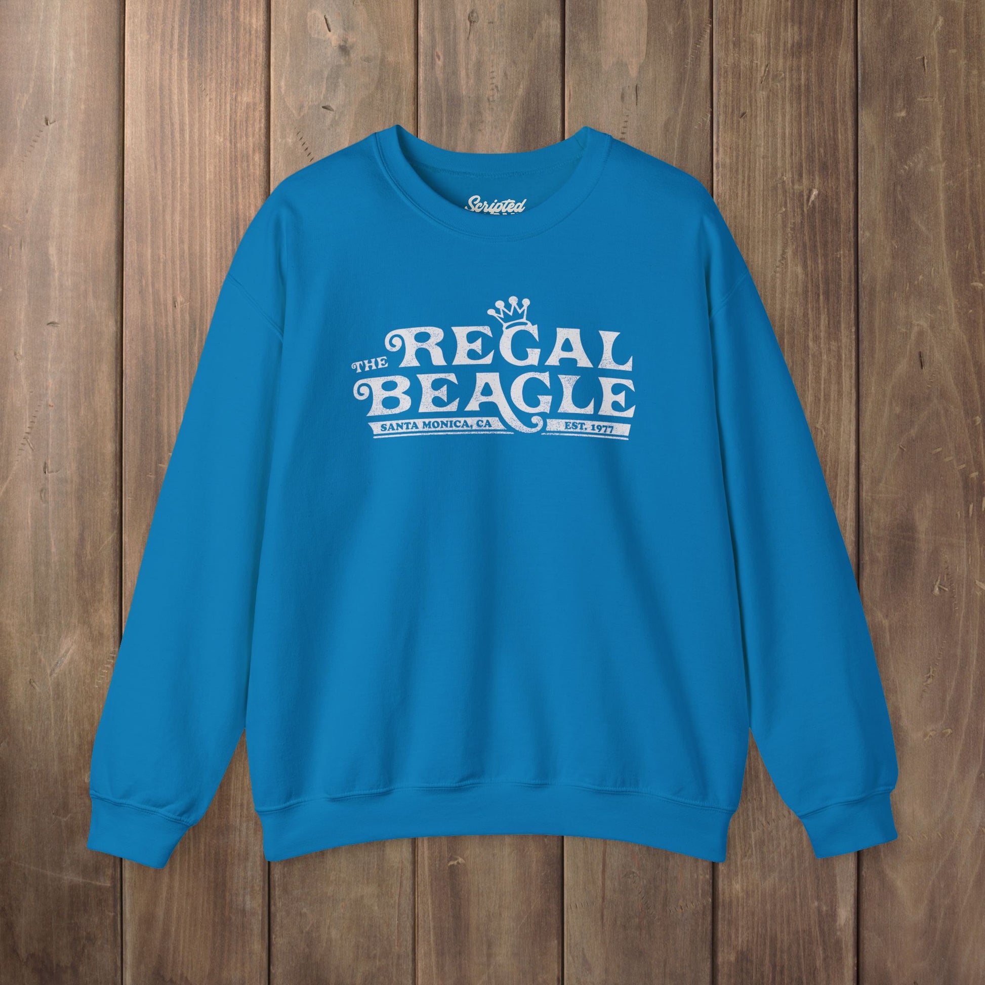 Saphire blue crewneck sweatshirt with vintage distressed blue Regal Beagle Three's Company logo