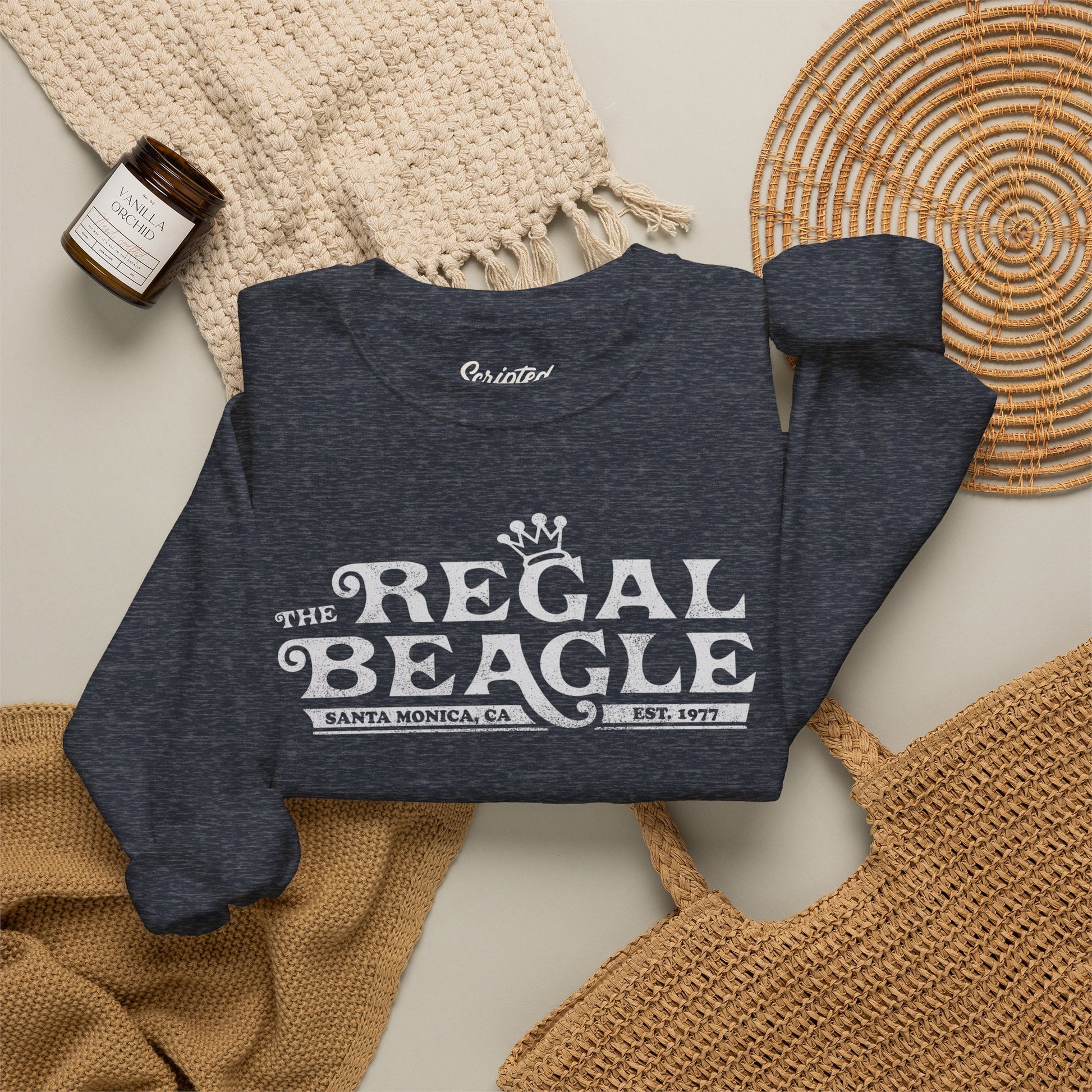 Folded Heather navy blue crewneck sweatshirt with vintage distressed blue Regal Beagle Three's Company logo