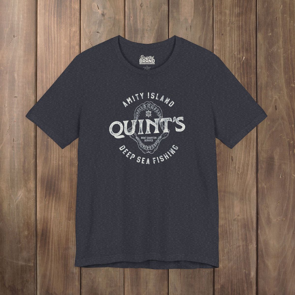Heather navy blue t-shirt featuring the Quint's Deep Sea Fishing Boat Charters logo graphic inspired by the movie Jaws in a vintage distressed style.
