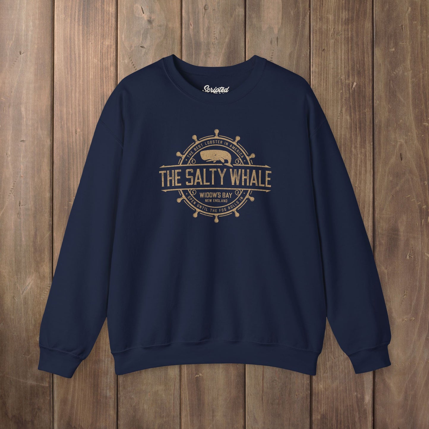 Navy blue Gildan crewneck sweatshirt with the distressed Salty Whale maritime crest logo from TV show Widow's Bay
