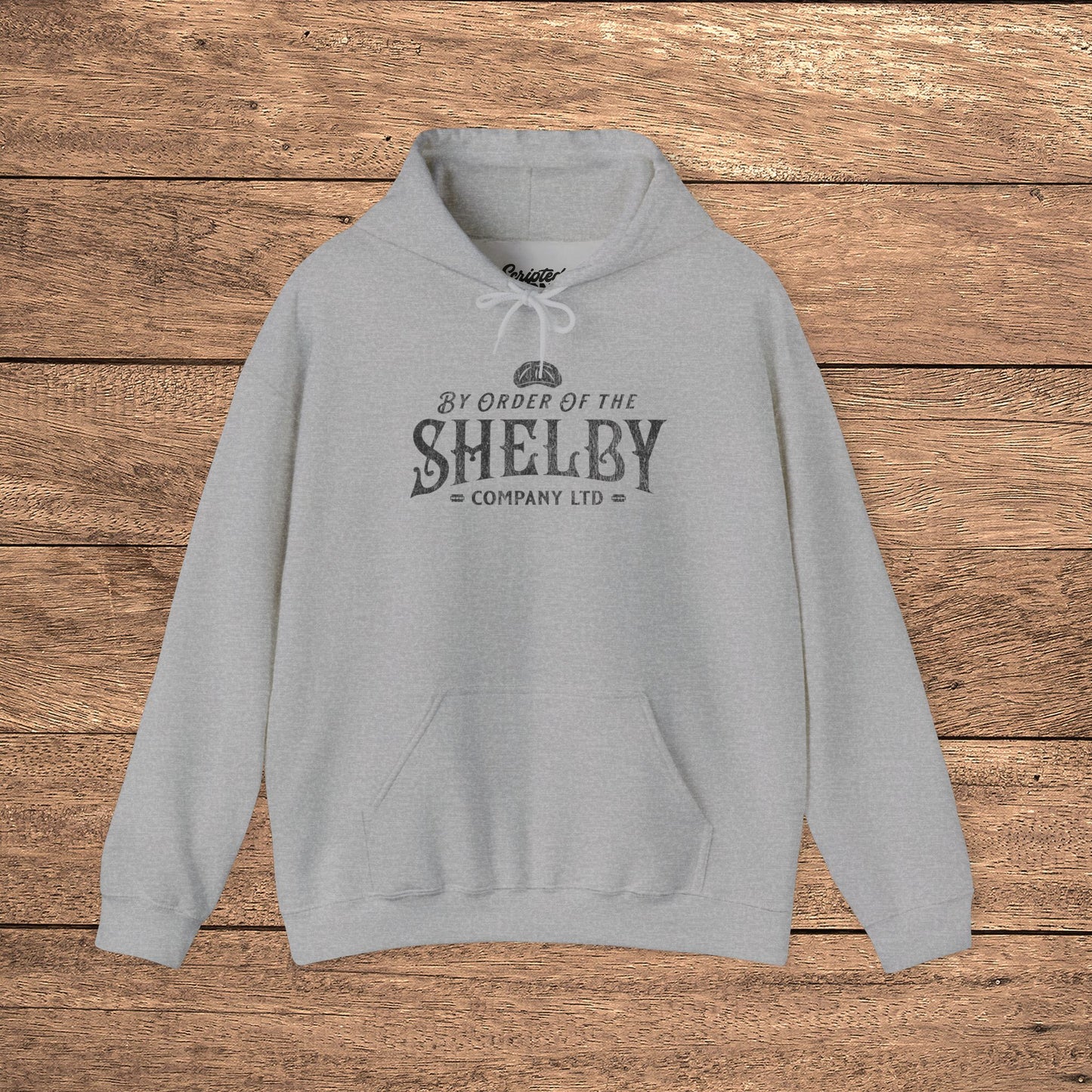 Heather gray Unisex Gildan 18500 Heavy Blend Hoodie Sweatshirt with a vintage Shelby Company Limited logo graphic from Peaky Blinders.