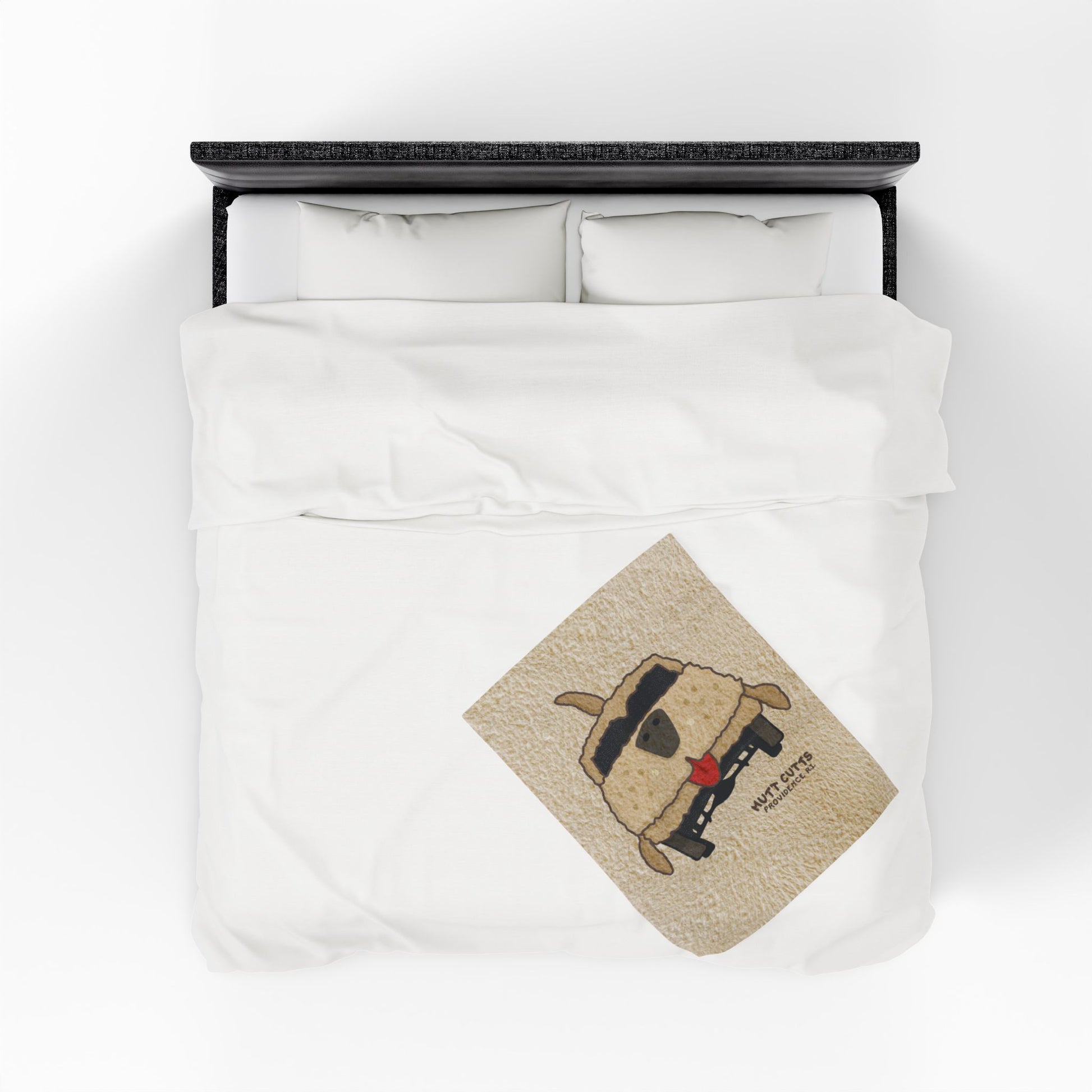 Top down view of 30x40 Velveteen plush blanket with large Mutt Cutts dog van graphic inspired by Dumb and Dumber, shown on a bed.