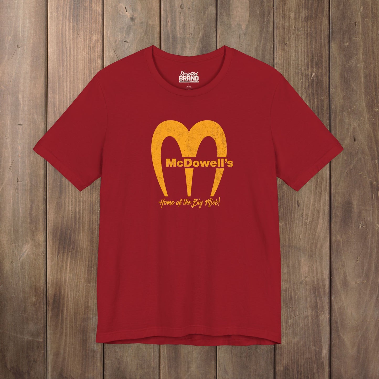 Red Bella+Canvas t-shirt featuring the McDowells logo from the movie Coming to America in a vintage distressed style.