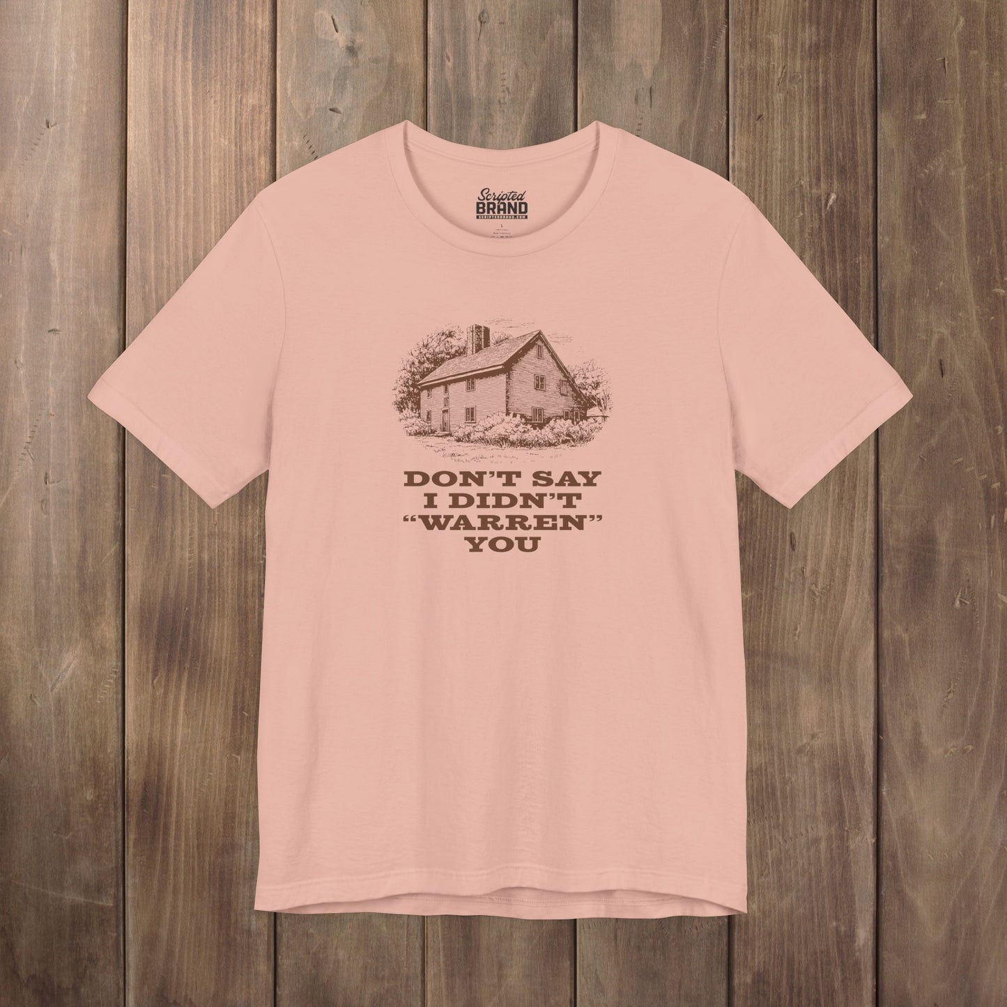 Peach Bella+Canvas tee with vintage Warren house illustration and the pun "Don't Say I Didn't Warren You" from Widow's Bay show